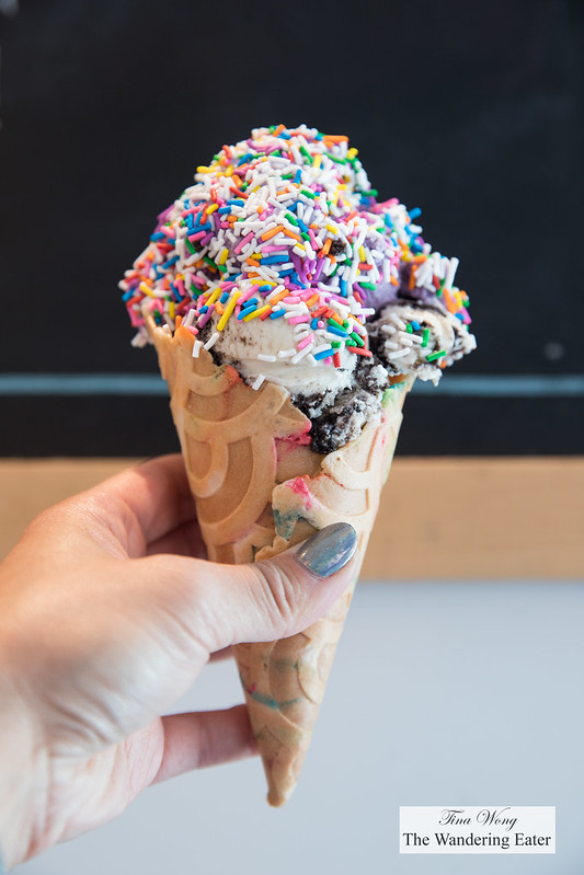 Cookies & Cream and blueberry lemon ice cream with rainbow sprinkles in a Konery cone