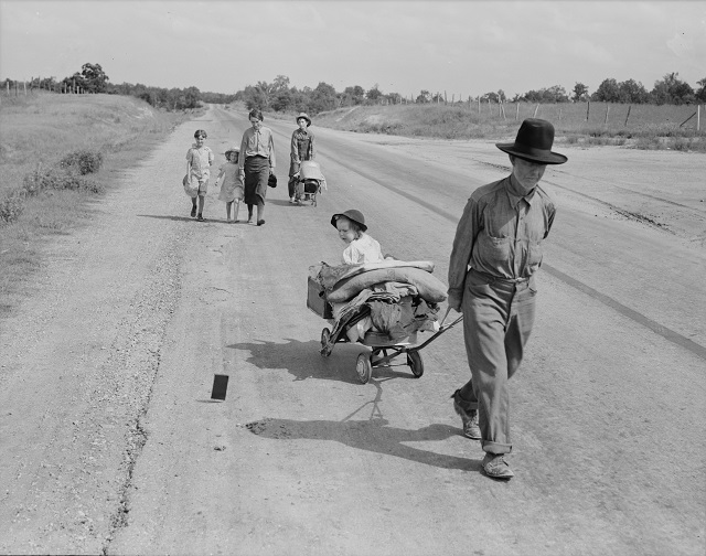 Dorothea Lange, Family walking on highway - five children. Started from Idabel, Oklahoma, bound for Krebs, Oklahoma, June 1938. Library of Congress.