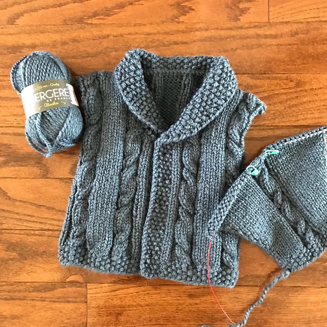 The modified Lion Brand Yarns sweet Heirloom Cables Baby Sweater WIP that is now finished