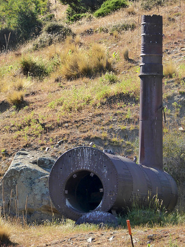 And Old Boiler Unit associated with a gold mining stamping battery just outside of Oturehua, along the Otago Rail Trail in the South Island of new Zealand.