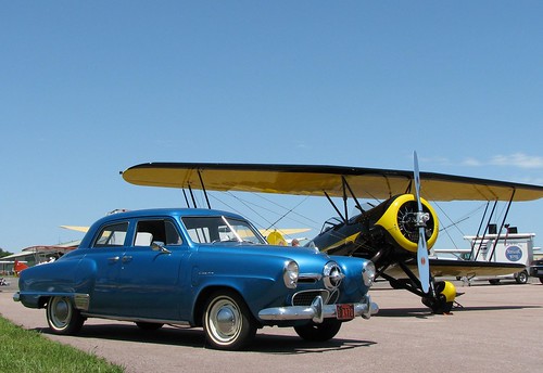 automobile vehicle aircraft biplane studebaker champion bulletnose airport antique vintage classic