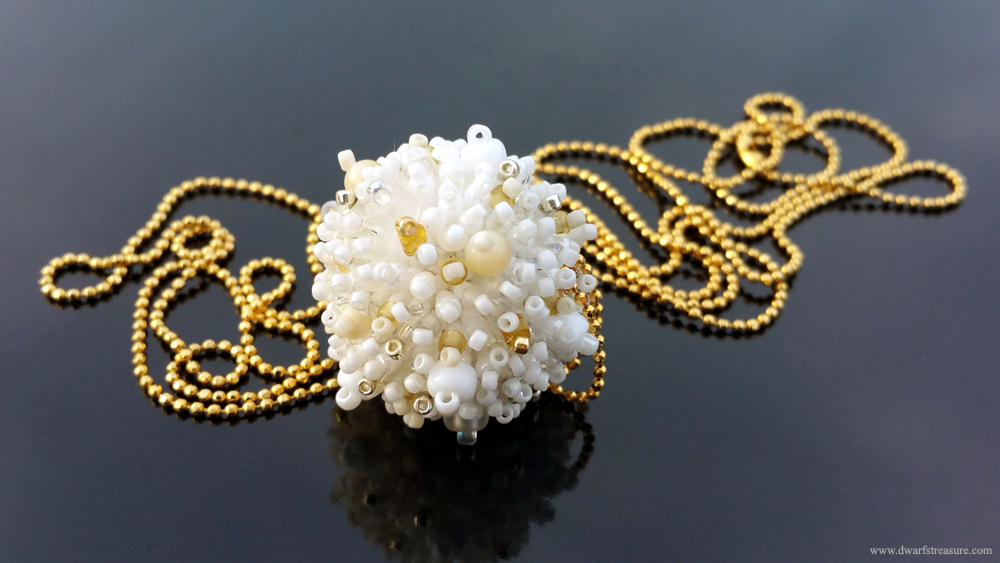 Stylish long chain necklace with fluffy white beaded ball pendant