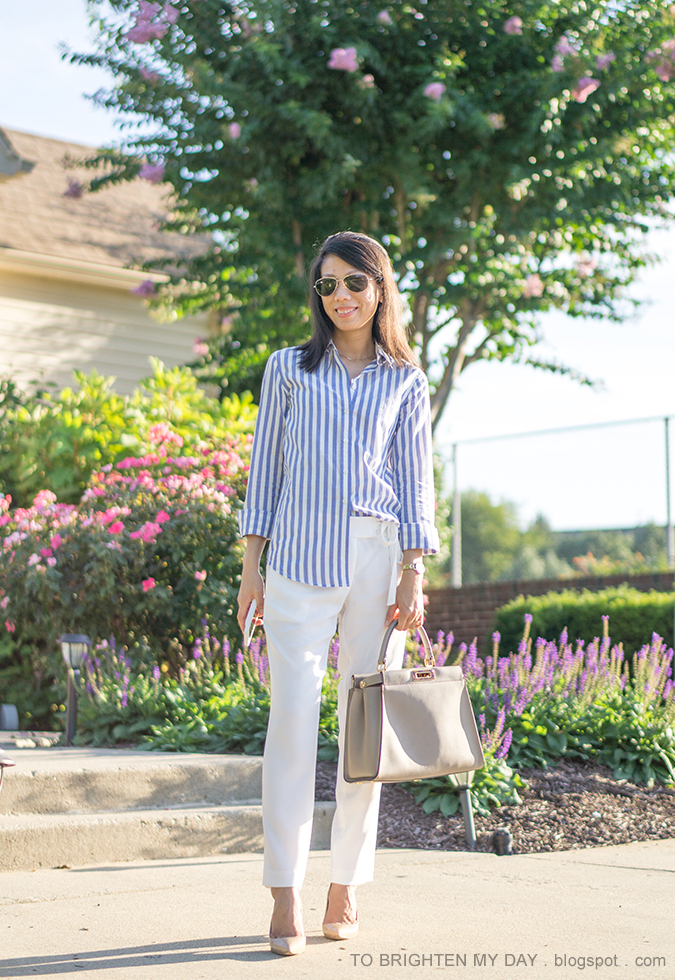 blue vertical striped button up shirt, white ankle pants with waist tie, dove gray tote, nude pumps, gold watch