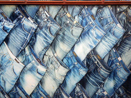Store window with stacks of jeans in Aalborg, Denmark