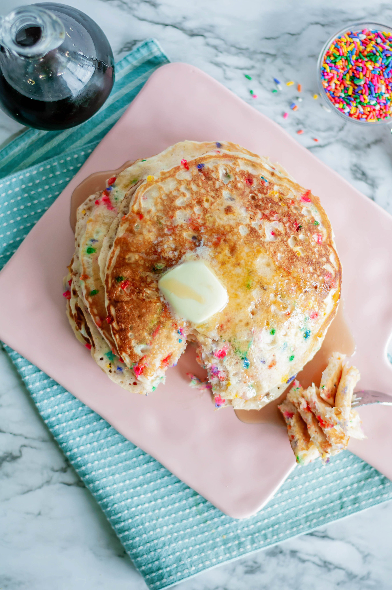 Funfetti Pancakes are a fun way to celebrate something special or brighten that Monday mood. Packed full of sprinkles and cake batter goodness.