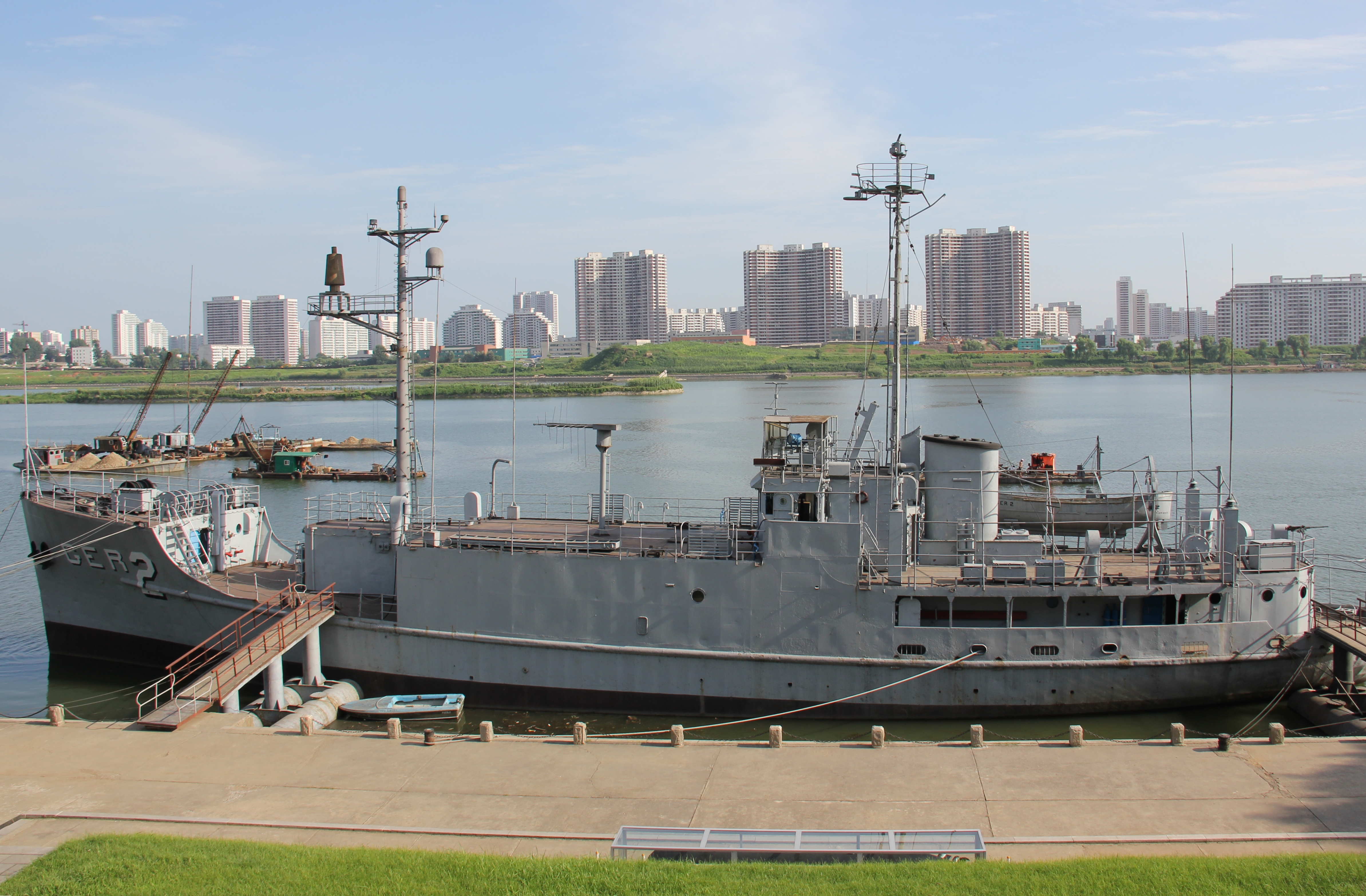 USS Pueblo remains in Pyongyang, North Korea, following her capture on January 23, 1968, and is currently the centerpiece of the Victorious Fatherland Liberation War Museum (조국해방전쟁승리기념관) spanning the Botong River. Photo taken on August 11, 2012.