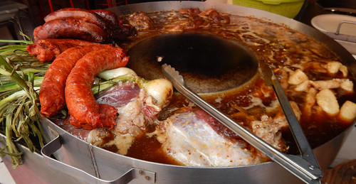 Meat stewing at a taco stand in Mexico City