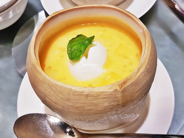 Chilled Mango Cream With Pomelo, Sago, And Ice Cream In Young Coconut