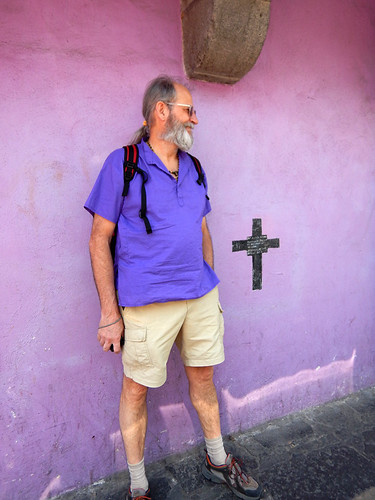 Al almost disappears against a purple wall in Puebla, a UNESCO Heritage site in Mexico