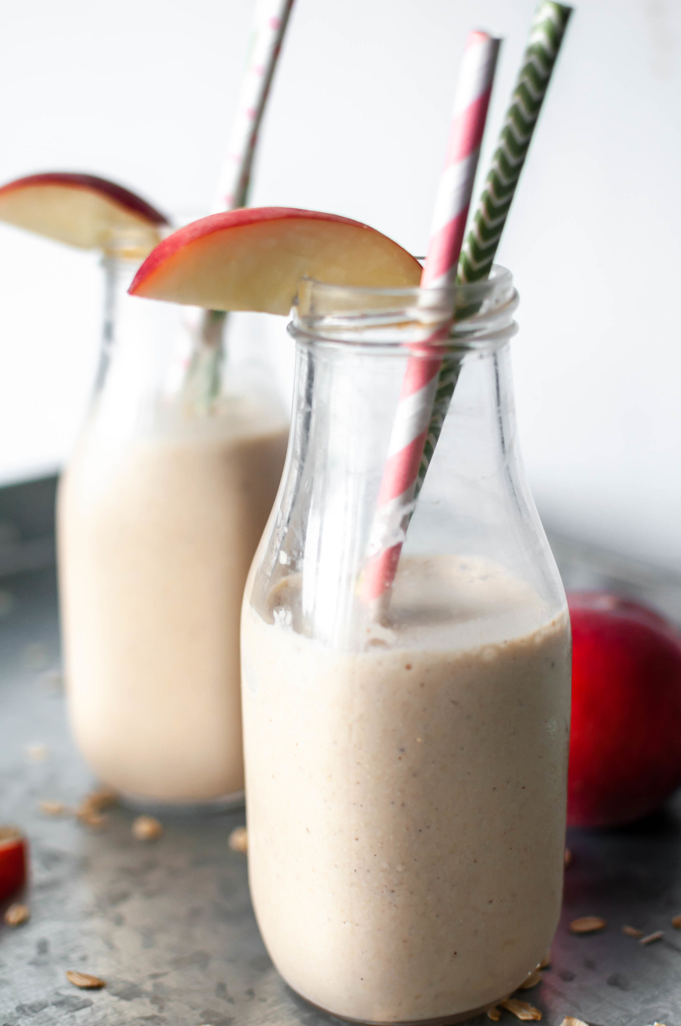 Peach Cobbler Smoothies bring all the sweet, crumbly dessert vibes to your breakfast. Packed with sweet peaches, oats, cinnamon and vanilla, it will taste like dessert in a glass.