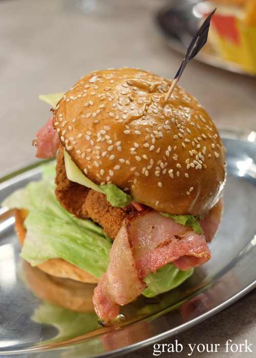 Grilled bacon inside the Britney chicken burger at Huxtaburger in Redfern Sydney