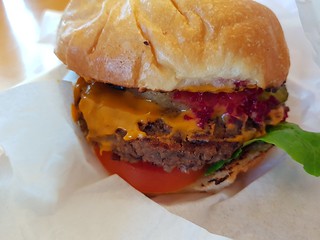 The Works Burger with pickles from Gatherers at Brisbane Vegan Markets