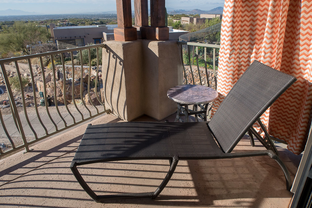 Lounge chair on balcony at Hacienda del Sol