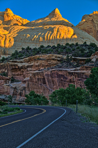 capitolreefnationalpark entradasandstone highway24 navajodome navajosandstone utah cliffs dawn dome geology morning sandstone sunrise vertical torrey unitedstates us