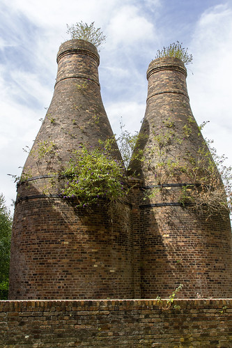pair bottle kiln ovens dominate landscape stoke england set against summer sky showing city industrial heritage that makes it synonymous with pottery manufacture kev grgory canon 7d brick brickwork old revolution vintage overgrown stokeontrent trent