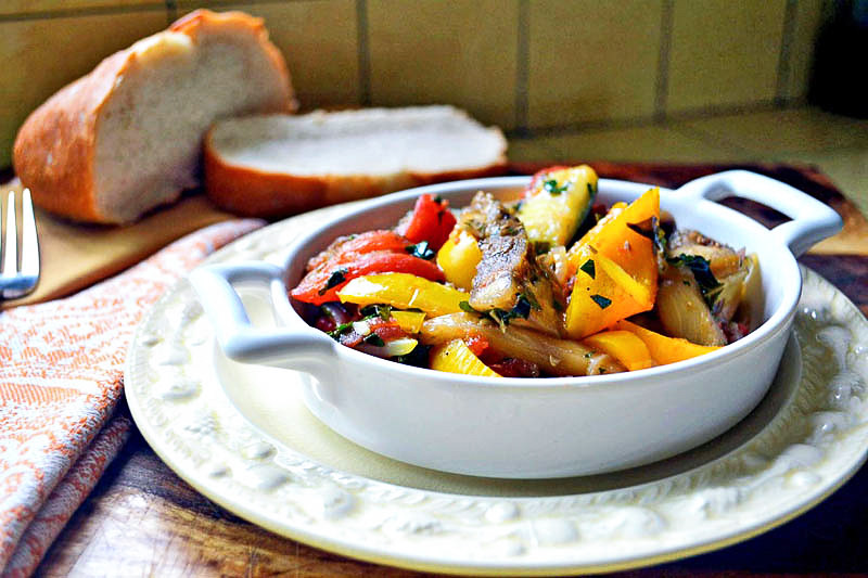 Julia Child's ratatouille recipe is a delicate and robust vegetable stew with tomatoes, zucchini and eggplant and layered with fresh herbs and garlic.