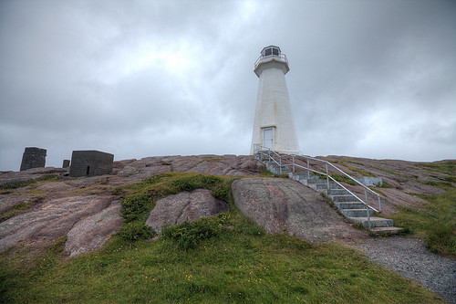 lighthouse capespear newfoundland canada atlanticcanada atlanticocean sky clouds cloudy hill rocks