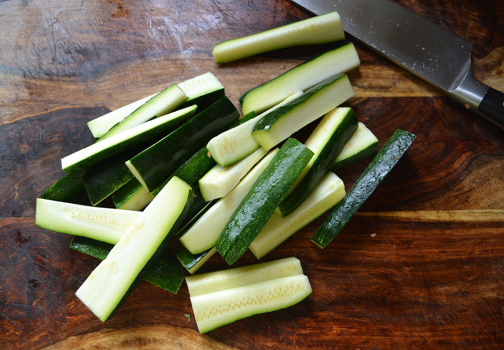 Slice zucchini into long strips to add to ratatouille.
