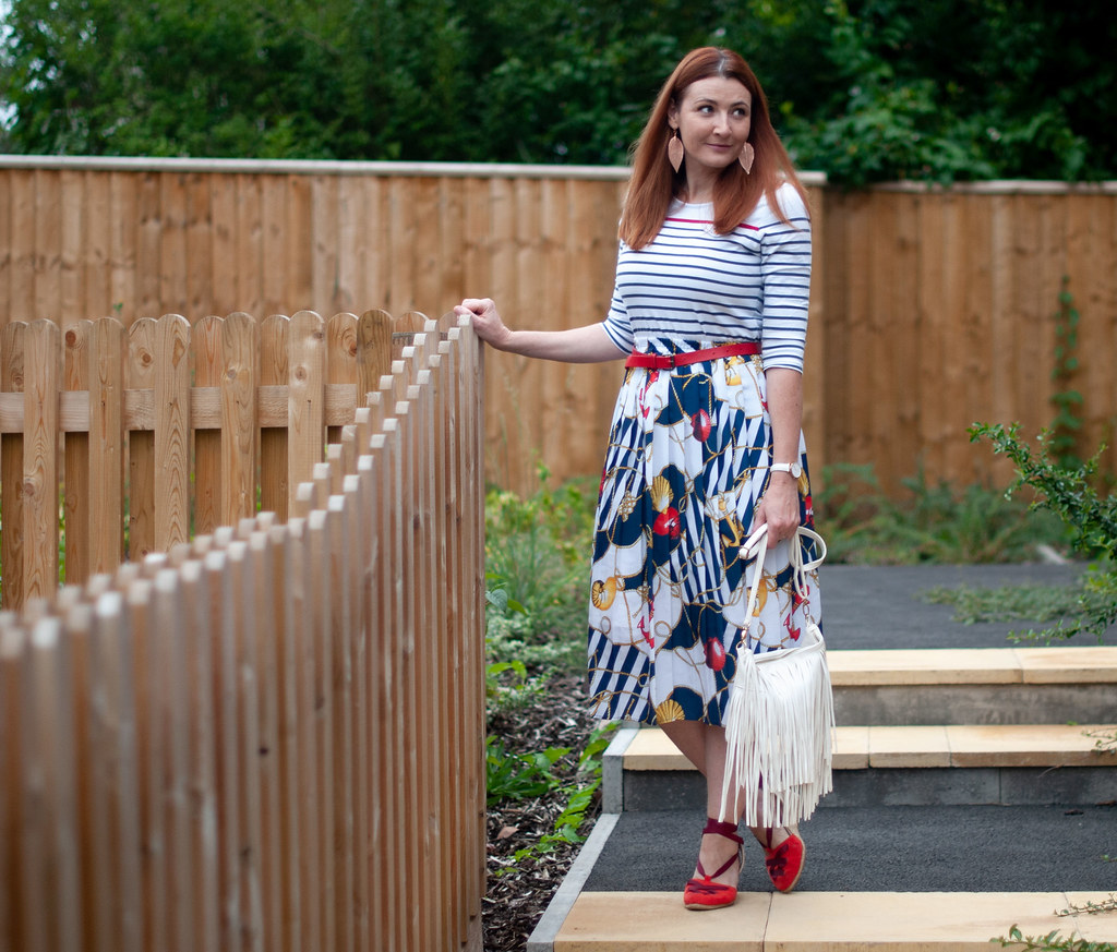 How to Wear a Vintage Nautical Look, Over 40 Style \ stripe Breton top \ vintage nautical print pleated midi skirt \ red espadrilles \ white fringe bag | Not Dressed As Lamb, over 40 fashion