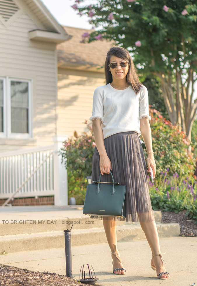 pave line pendant necklace, white sweater tee with fringe, gold bangle, bottle green tote bag, gray tulle midi skirt, suede ankle tie sandals with jewels