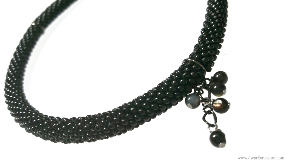 Elegant beaded glass statement necklace with black pearls