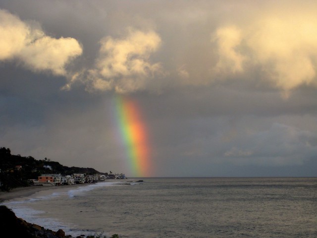rainbow falls into the sea