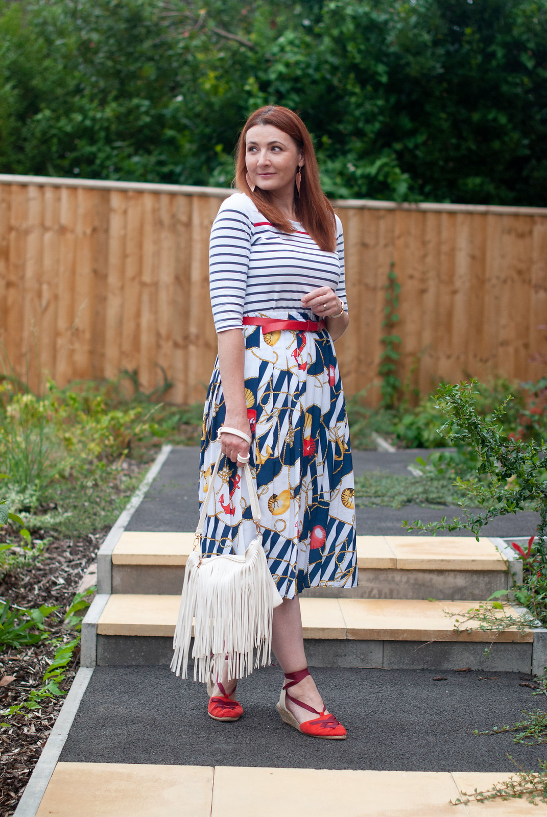 How to Wear a Vintage Nautical Look, Over 40 Style \ stripe Breton top \ vintage nautical print pleated midi skirt \ red espadrilles \ white fringe bag | Not Dressed As Lamb, over 40 fashion