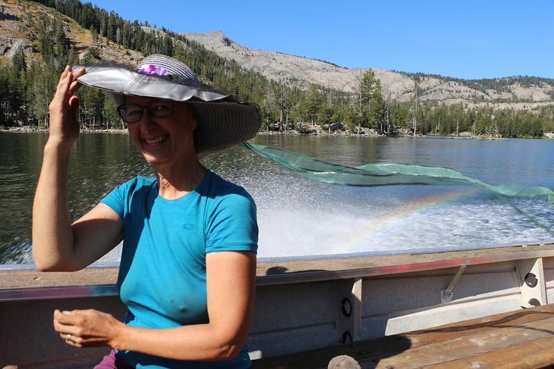 Vicki is having a great time on the Echo Lake Water Taxi - complete with a rainbow in the spray