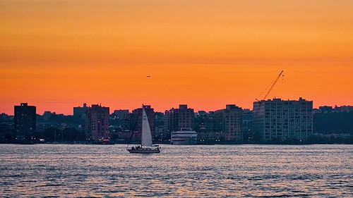 airplane boat buildings city cityscape dusk hoboken hudsonriver newjersey newyork night nightscape nyandreas river sailboat skyline sunset water sunlight colorful color colour dramatic landscape