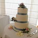 Three tiered Wedding cake with Sea Mist Ribbon and fresh flowers.
