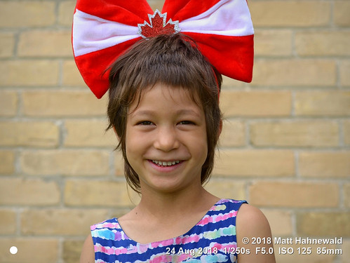 matthahnewaldphotography facingtheworld people character head face eyes childreneyes mouth expression smile headgear headdress consent fun parentalconsent concept canada patriotism politicalcorrectness culture education childhood optimism diversity empowerment cultural brussels ontario ontarian canadian individual oneperson female child girl nikond610 nikkorafs85mmf18g 85mm horizontal street portrait closeup headshot fullfaceview outdoor posing smiling pretty cheerful humour mapleleaf asiancanadian mixedrace visibleminority southeastasiancanadian clarity canadianflag redandwhite peoplekind 4x3ratio 1200x900pixels resized lookingatcamera colour