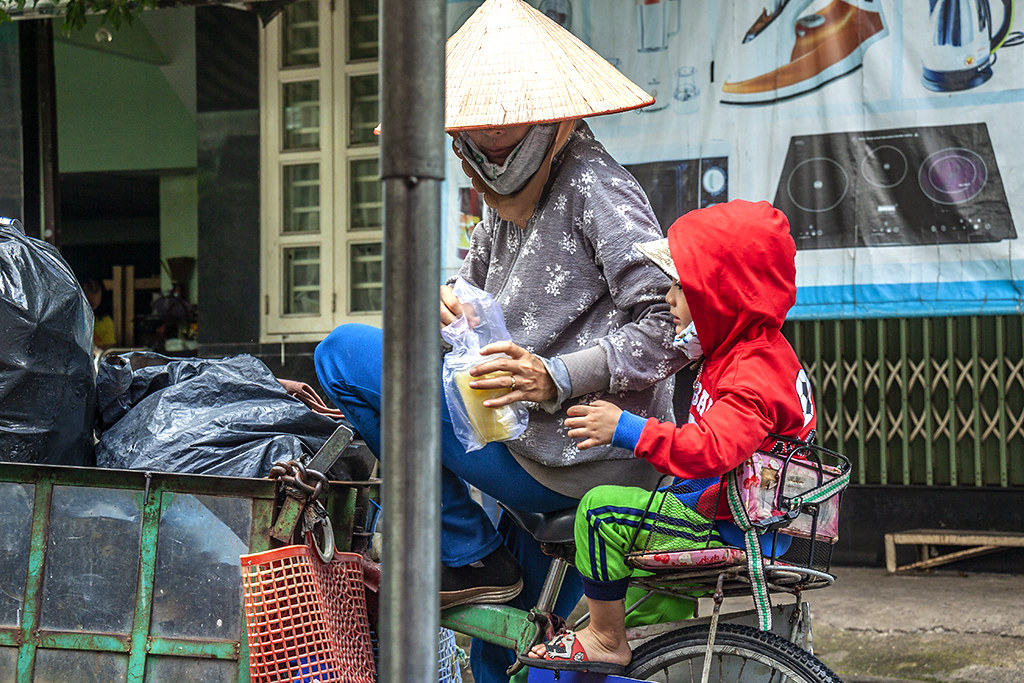 Working woman and child in Phu Lam--Saigon