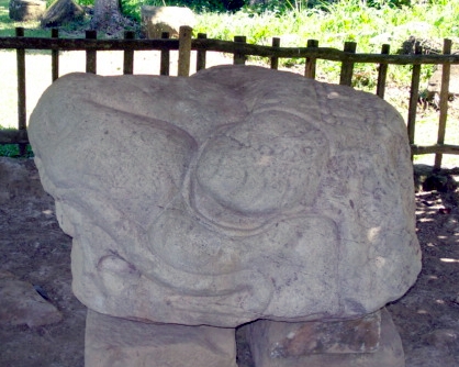 Altar M at Quiriguá, Guatemala, dating to 734. It has been identified variously as feline, a crocodile, and a snake. It may be a three-dimensional representation of a rare toponymic glyph Photo taken on March 28, 2009.