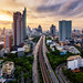 Aerial view of Bangkok skyline panorama and skyscraper with light trails on Sathorn Road center of business in Bangkok city Thailand.