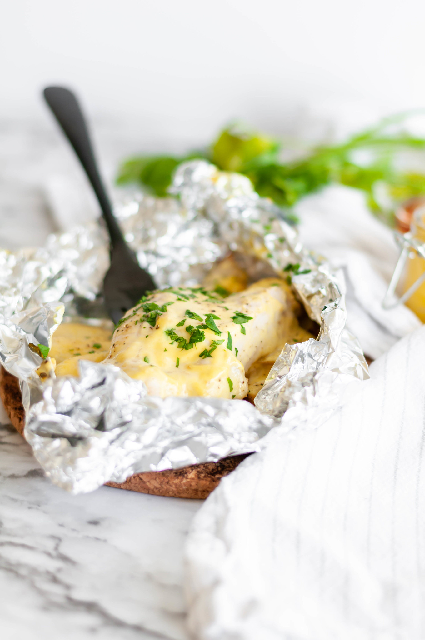 Honey Mustard Chicken and Potato Foil Packs are a simple weeknight dinner the whole family will love. Chicken breasts, thinly sliced potatoes and a simple homemade honey mustard sauce.
