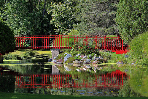 red redorange vermillion carmine bridge redbridge pedestrianbridge reflection water pond river rocks boulders landscape scenery trees peaceful serene shadows midland michigan jannagalski jannagal