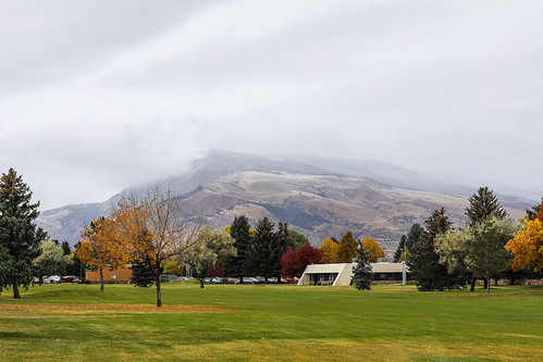 wyoming cody rattlesnakemountain parkcounty oliveglenngolfcourse storm clouds fog autumn fall trees color yellow red building wyojones np