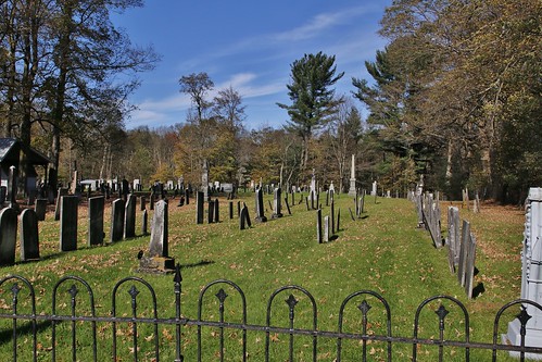 fall cemetery graveyard bone garden headstone slatestones green gray sunshine clouds iron fence old trees forefathers