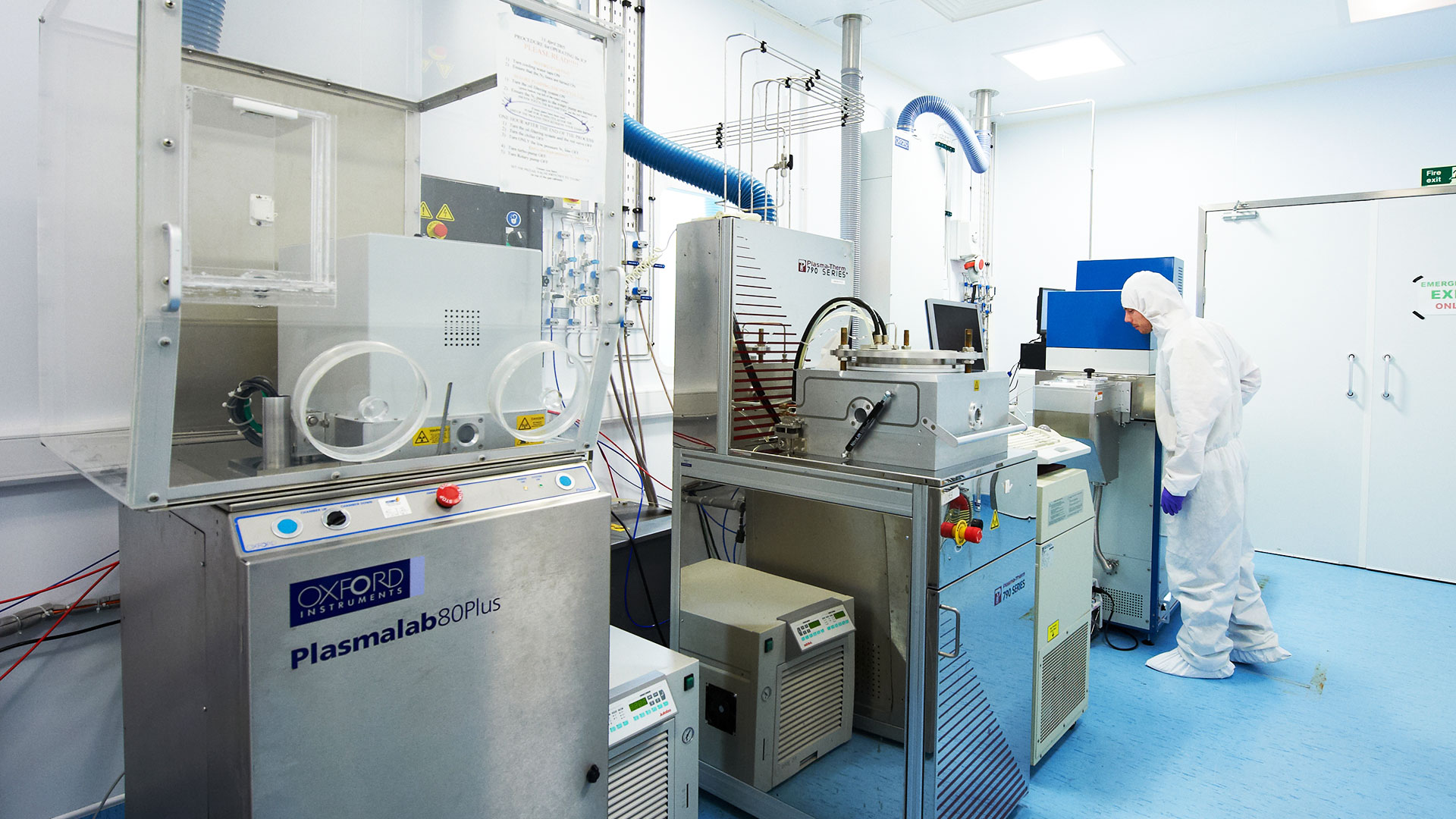 A researcher using specialist materials processing equipment in the David Bullett Nanofabrication Facility