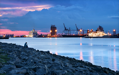 blue hour sunset port canaveral florida space coast brevard county cruise ship gantry long exposure sony a7rii 70200mm sea wall seawall jetty rocks shiny reflection rock concrete cement plant boat sky water bay inlet shore rocky crane container moody transcendental amanecer atardecer cielo nubes puesta del sol puerto ocaso dusk twilight nightfall sentimental