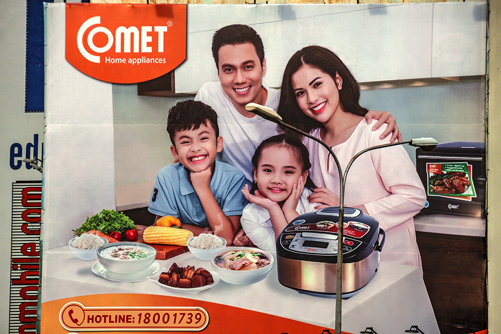 Happy family in Comet home appliances ad--Saigon