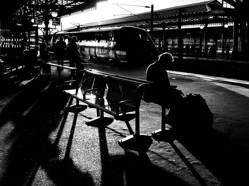 ifyoucouldreadmymind book reading sunset passenger sitting 1y38 91125 sun bench seat shadows class91 departure waiting backlighting halo station