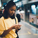 Young asian girl waiting for transportation underground at Bangkok MRT