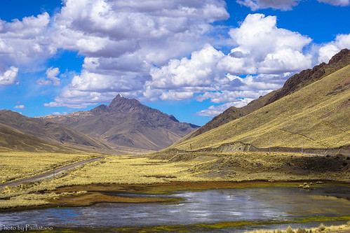 travel peru nature landscape andes altiplano mountains mountain mountainside sky cloud laraya railway lake water road