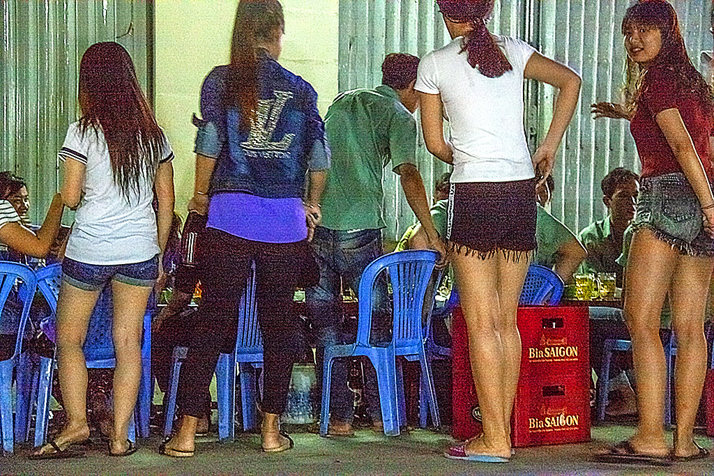 Factory workers and friends carousing near Phu Dinh Market--Saigon