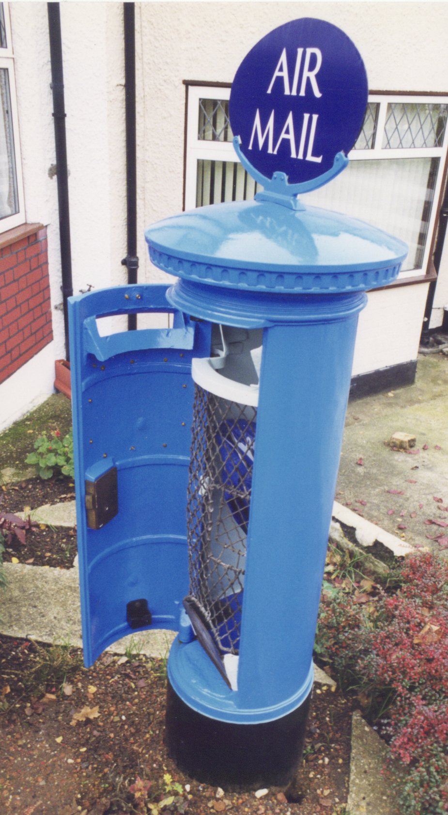 Air Mail pillar box in original blue colors at South Harrow. Photo taken on July 1, 1999.