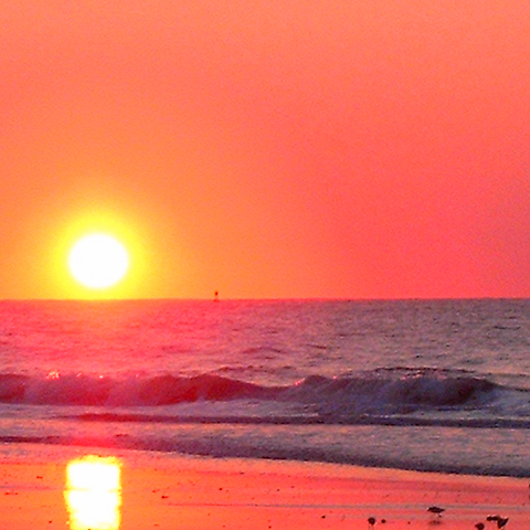a lurid colour sunset over the sea