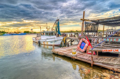 shrimpboats texas water sunset clouds color aransaspass moored old wood pier nets