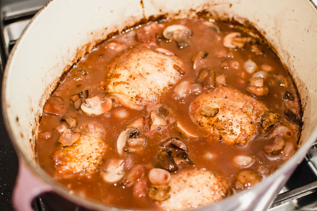 Add the sauteed mushrooms and onions to the simmering voq au vin and cook everthing together so flavors blend.