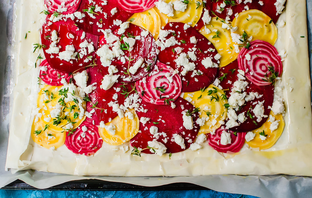 This colorful beet phyllo tart is an easy and impressive appetizer. Thinly sliced beets are layered on top of phyllo sheets and scattered with salty feta and fresh aromatic thyme.